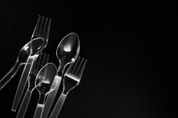 plastic table wares on black background